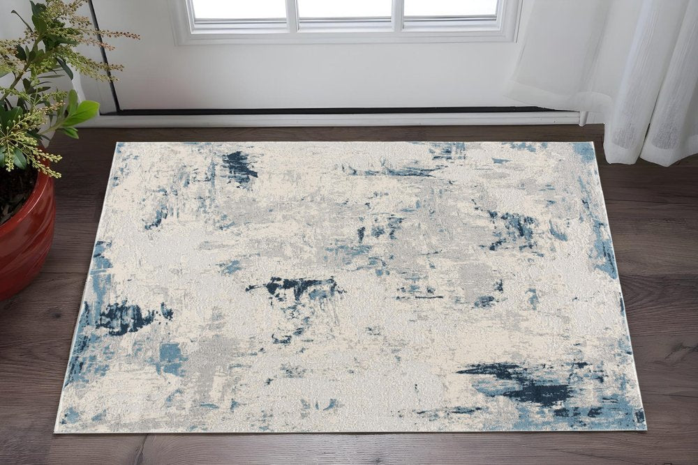 5' X 8' Blue And Ivory Abstract Strokes Area Rug