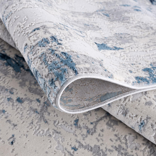 5' X 8' Blue And Ivory Abstract Strokes Area Rug