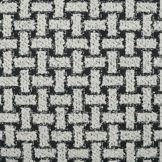 Black and white woven fabric with a chunky basket-weave texture; tweed-like upholstery material.