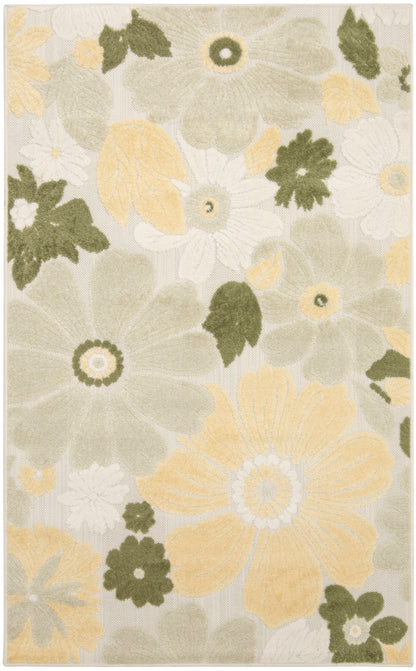 Floral area rug featuring large cream and pale yellow flowers with sage green leaves on a beige background.