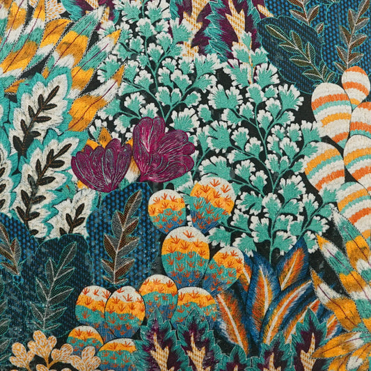 Vibrant tropical fabric print in teal, orange, yellow and purple with leafy, cactus-like and feathered motifs.