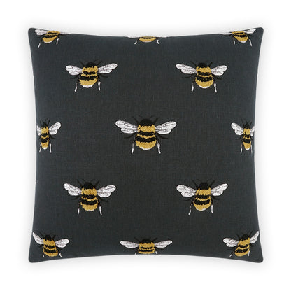 Dark charcoal square decorative pillow with repeating yellow-and-black bees on white wings, embroidered.