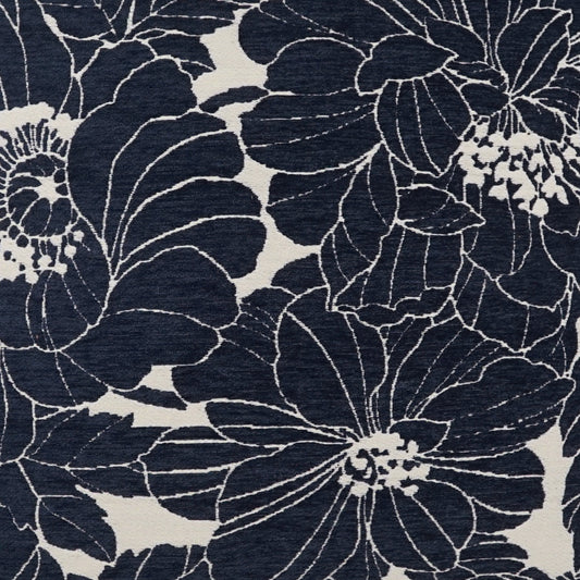 Navy floral fabric with large light-outline blooms on a cream-beige background and a woven texture