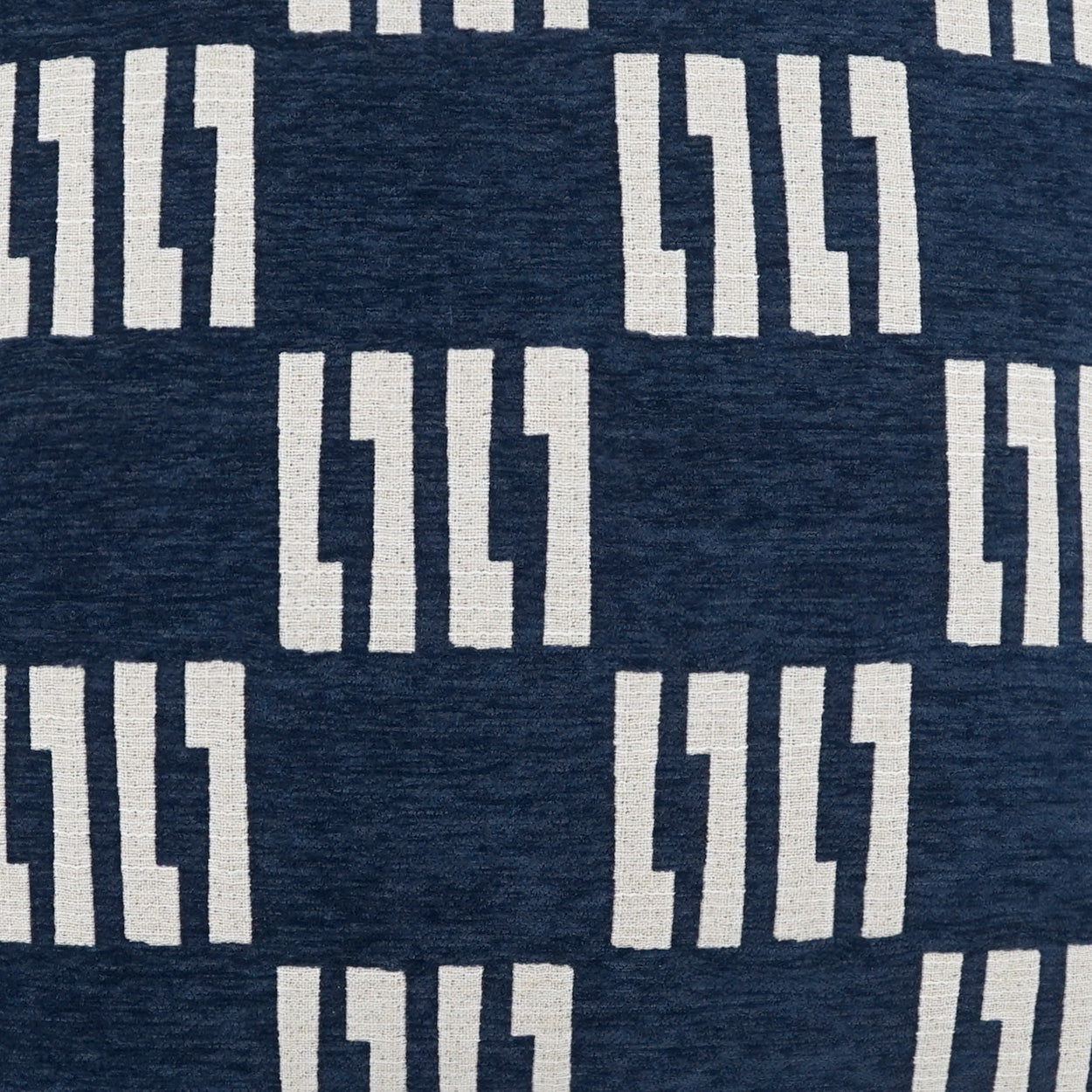 Navy fabric with repeating cream rectangular block motif in vertical columns.
