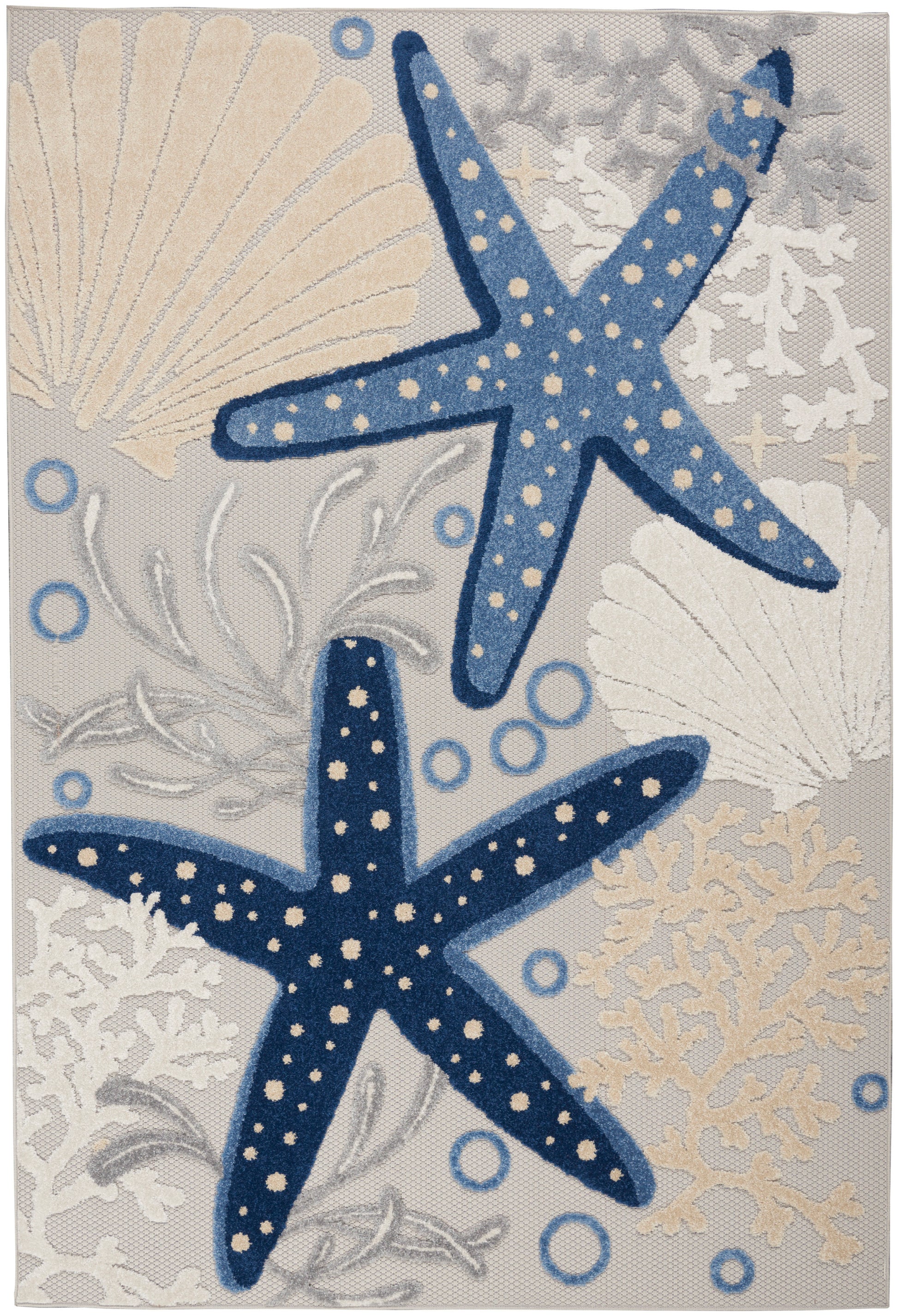 Coastal rug showing light- and dark-blue dotted starfish with shells, coral and bubbles on a gray backdrop.