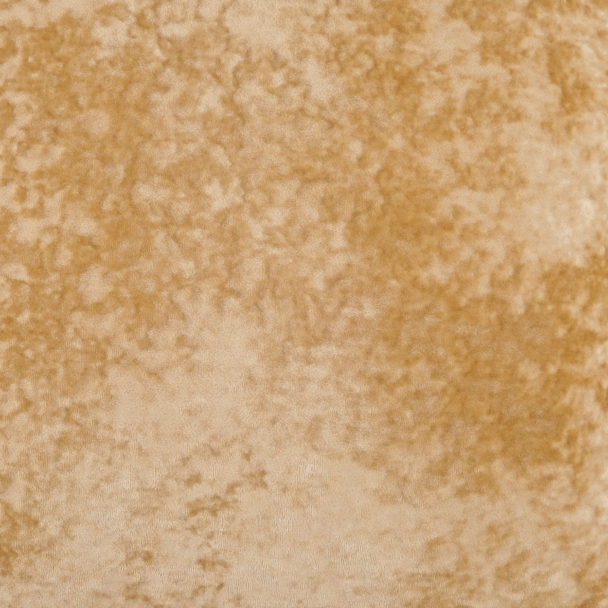 Crushed gold-tan velvet pillow fabric texture, close-up view.