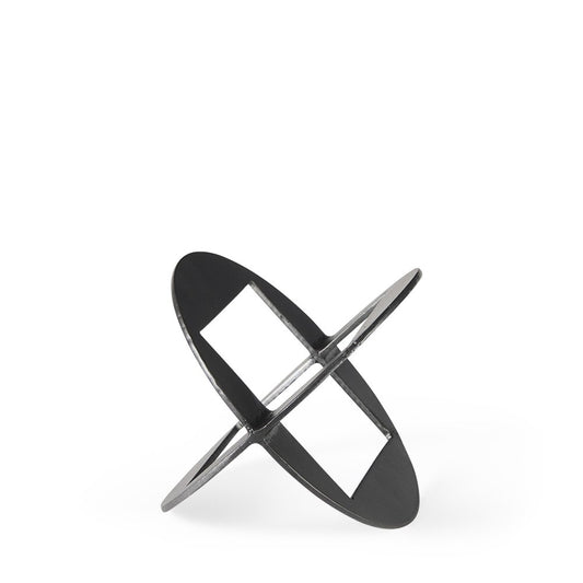 Black cast iron tabletop sculpture: two flat circular discs crossed to form an X, connected by a central bar.