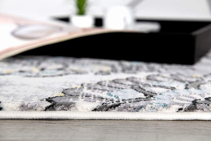 5' X 7' Gray And Ivory Floral Area Rug