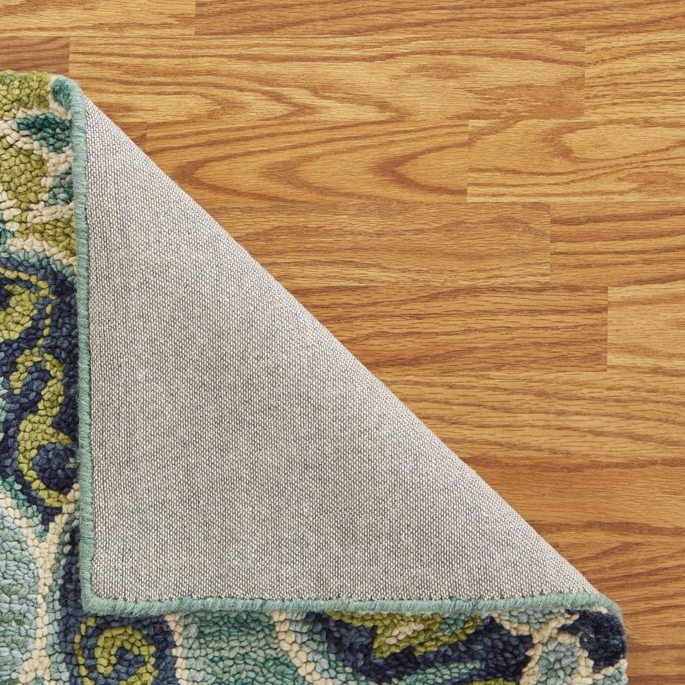 6' Green And Ivory Wool Geometric Hand Tufted Round Rug