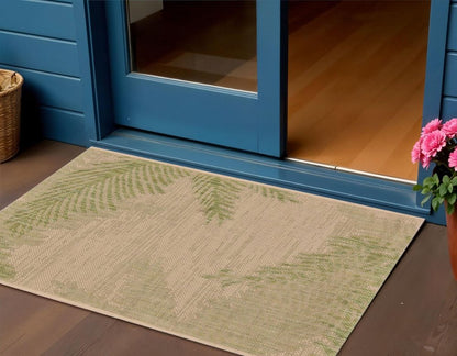 5' X 7' Beige And Green Palm Leaf Indoor Outdoor Area Rug