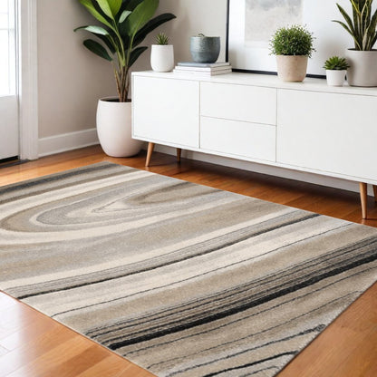 5' X 8' Cream and Tan Abstract Marble Area Rug