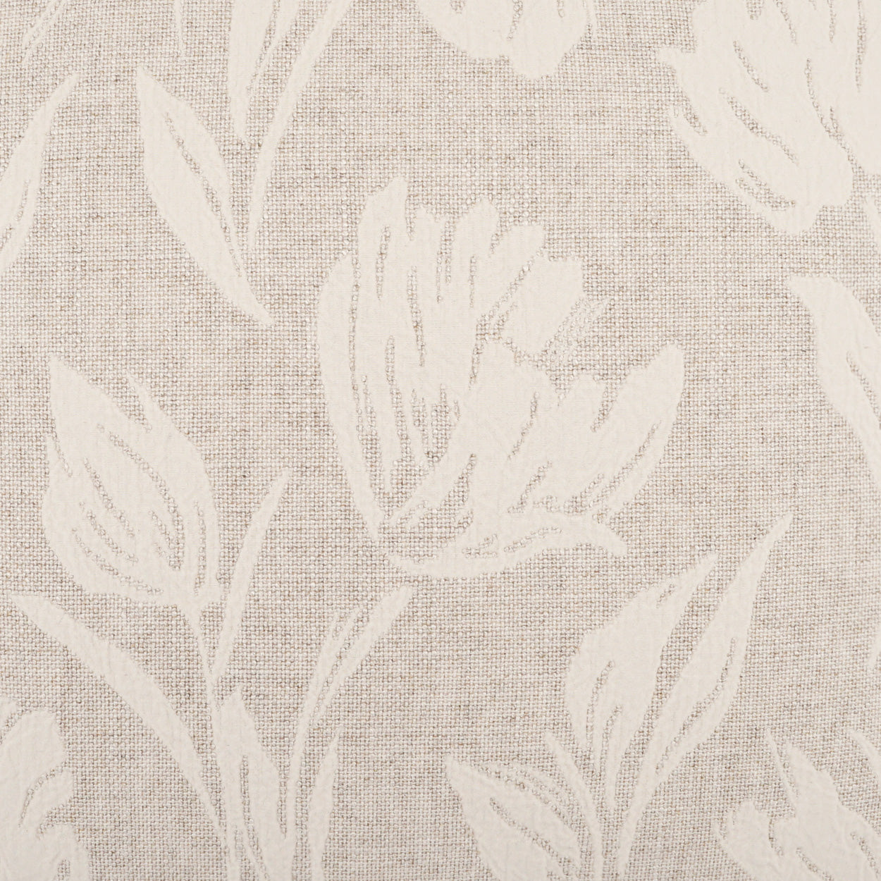 Beige linen-textured fabric with a large white floral pattern of blossoms and leaves.
