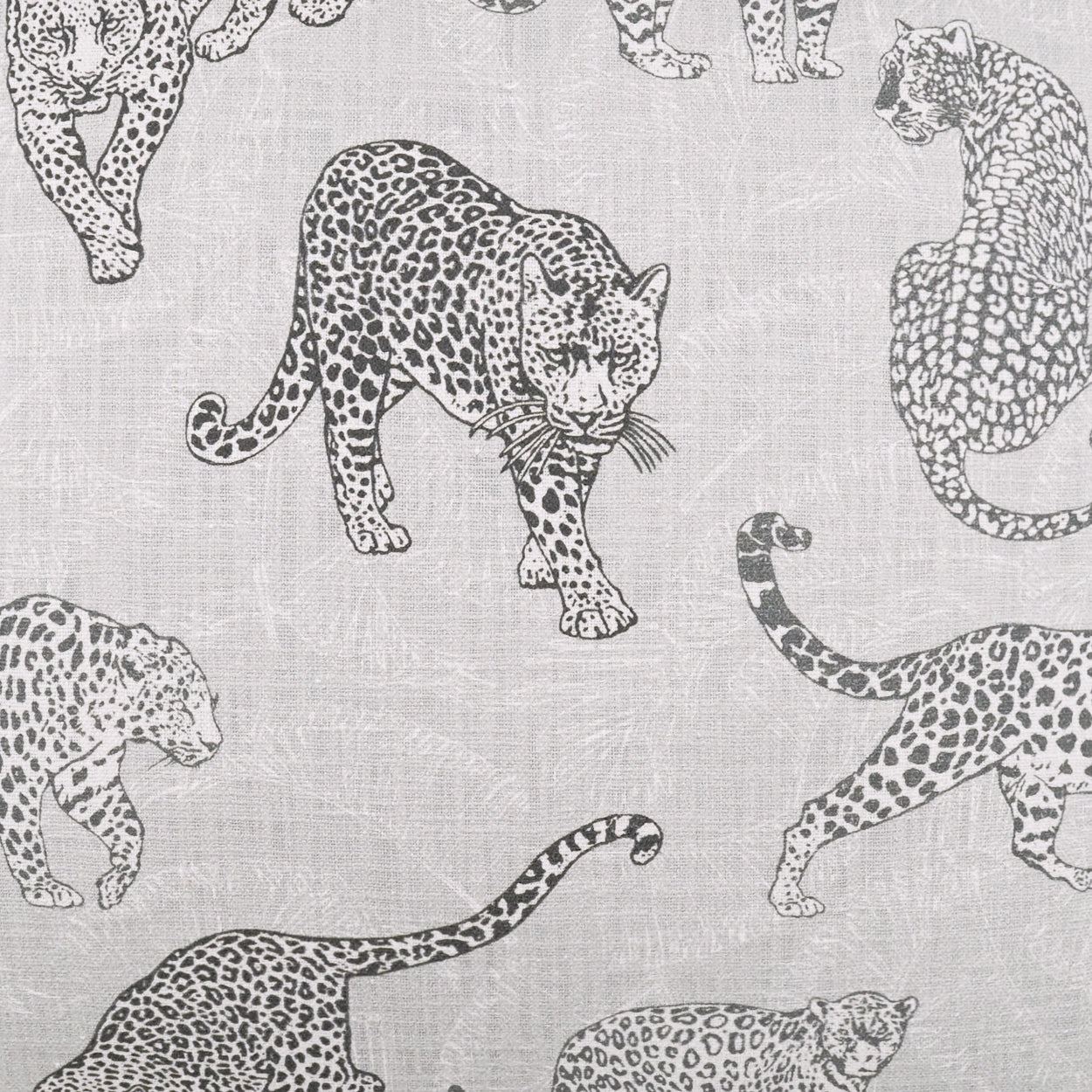 Grey linen-like fabric with repeated black leopard silhouettes; wildlife print for upholstery, cushions, or drapery.