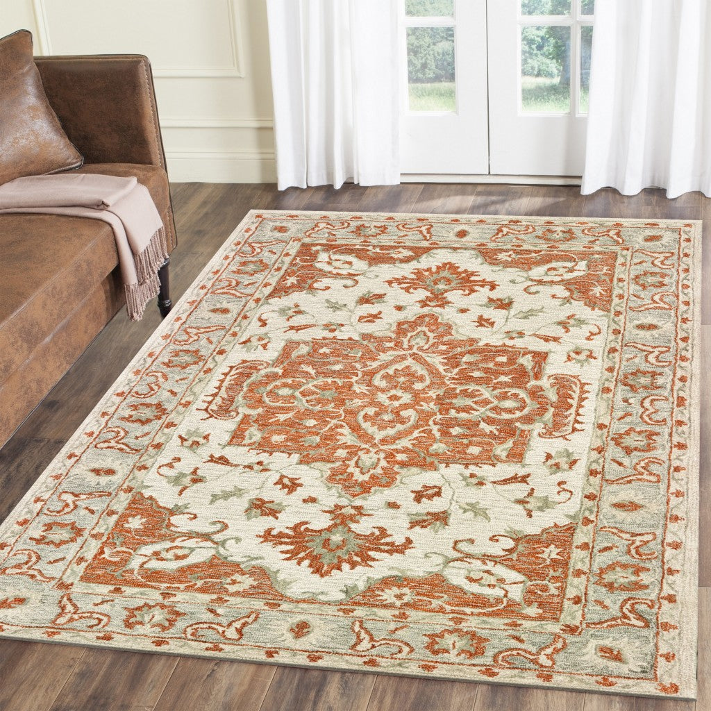 9' X 12' Orange and Ivory Medallion Area Rug