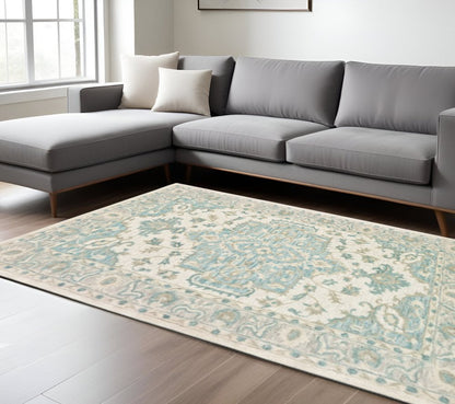 5' X 8' Turquoise and Cream Medallion Area Rug