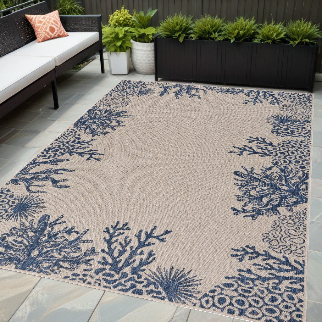 5' X 7' Beige and Blue Coral Stain Resistant Indoor Outdoor Area Rug