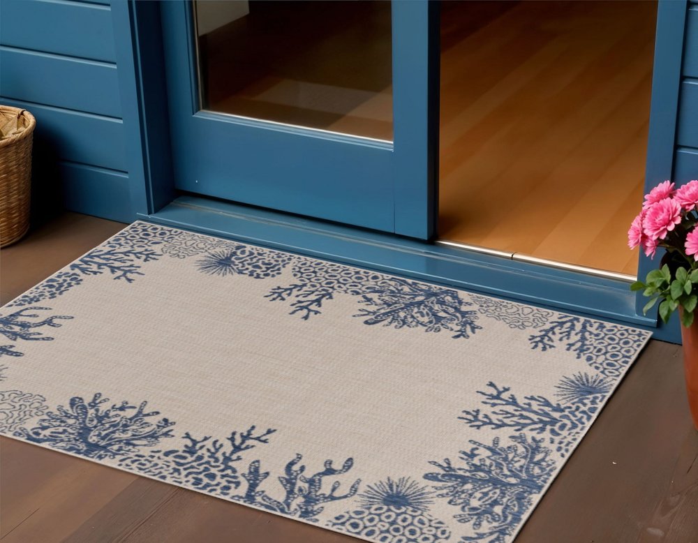 5' X 7' Beige And Blue Coral Indoor Outdoor Area Rug