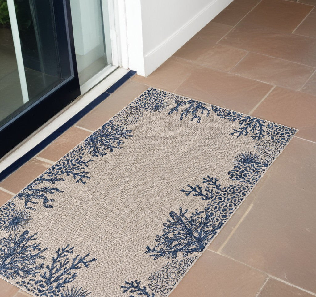 5' X 7' Beige and Blue Coral Stain Resistant Indoor Outdoor Area Rug