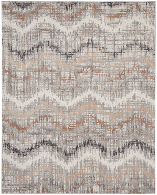 Neutral woven area rug with wavy chevron stripes in beige, taupe, gray, and soft rust tones.