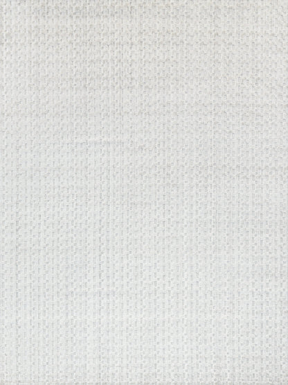 Close-up of a light gray textured rug with a small square grid pattern.