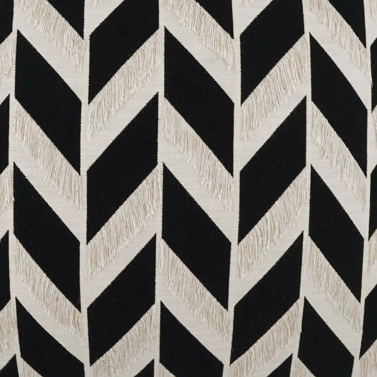 Black and cream chevron woven fabric with textured beige zigzags for upholstery.