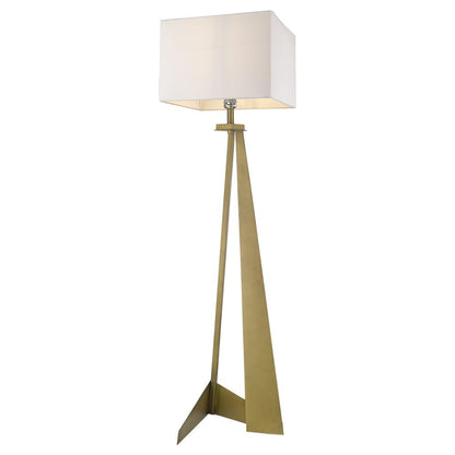 Brass tripod floor lamp with rectangular white shade and three-legged geometric base.