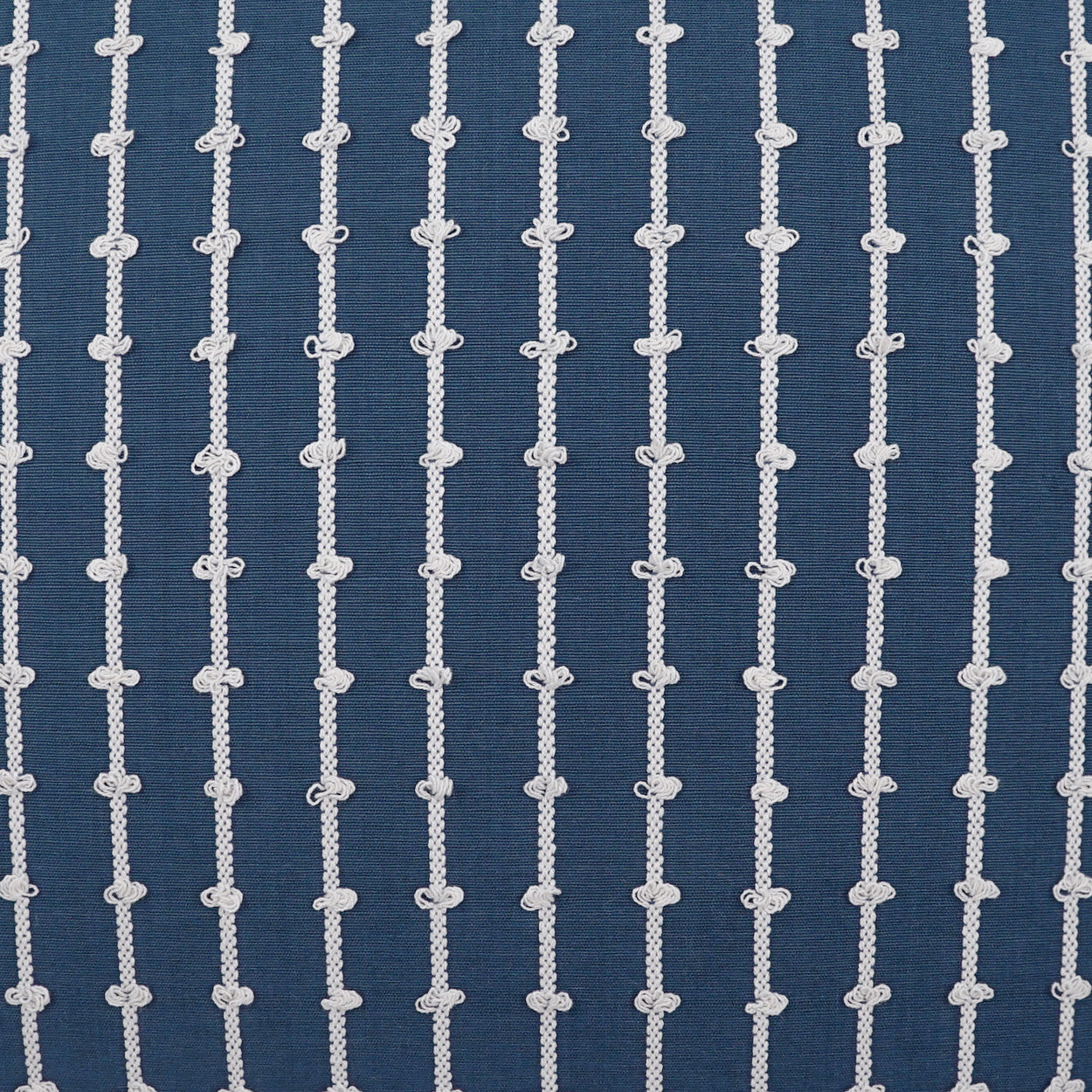 Navy blue fabric with vertical white rope-pattern stripes and knotted accents.