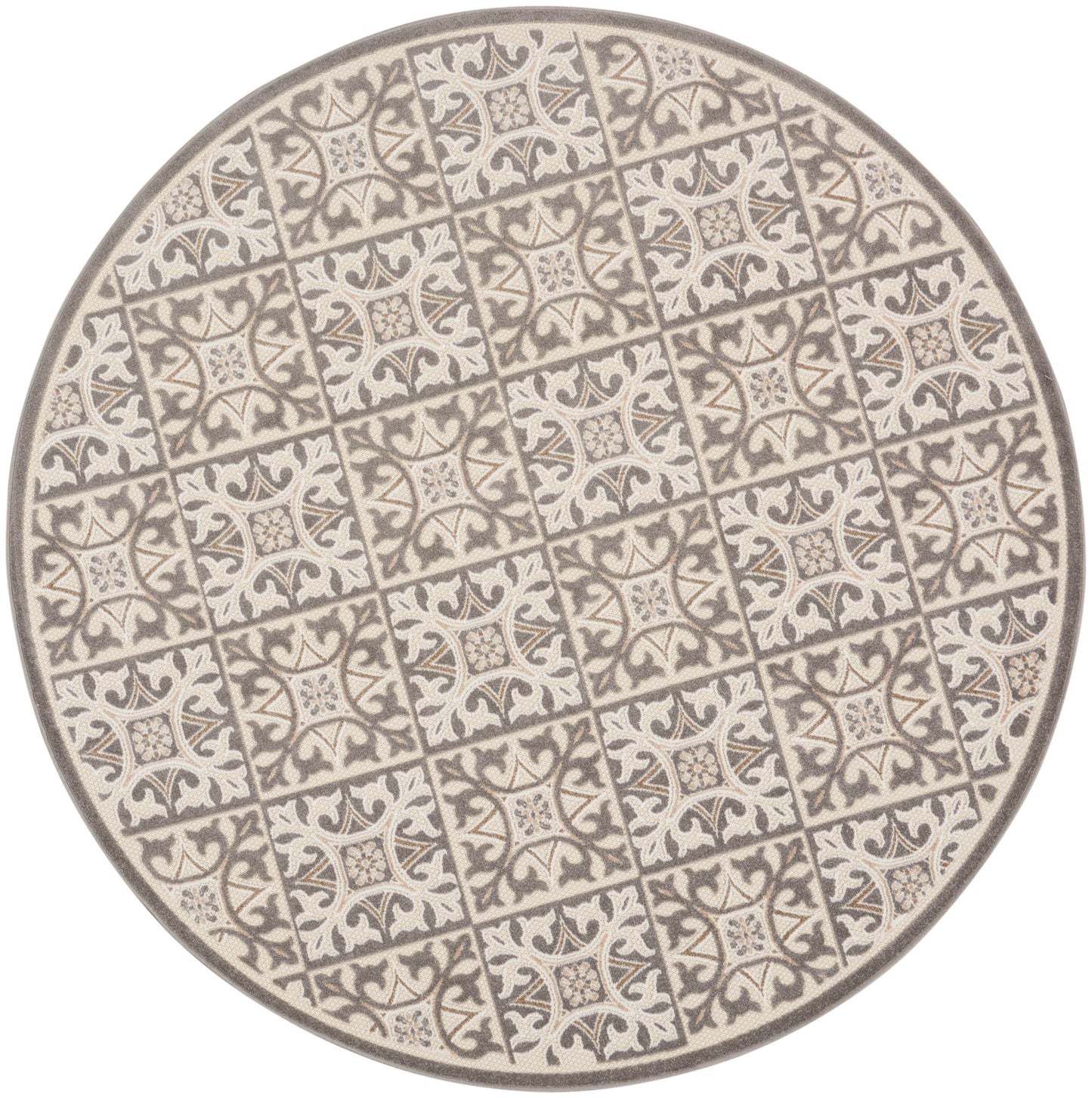 Round ceramic plate with cream and gray tile motif and ornate floral patterns in a repeating grid.
