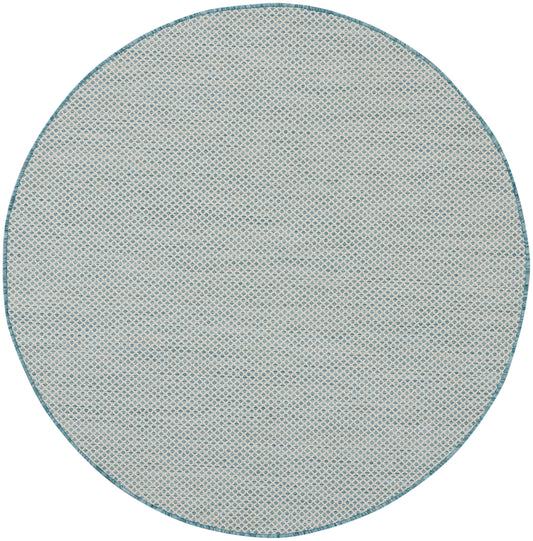 Round beige area rug with a teal border and subtle blue diamond lattice pattern.