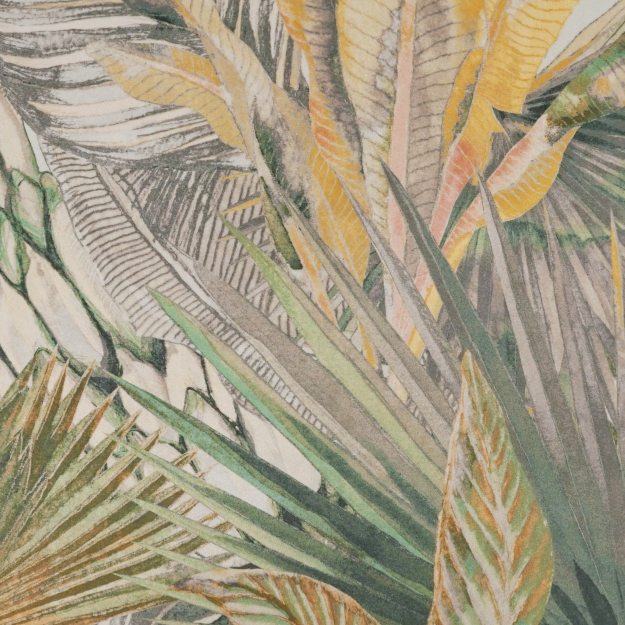 Tropical palm leaf print fabric in green, yellow and beige; lightweight textile for decor or apparel.