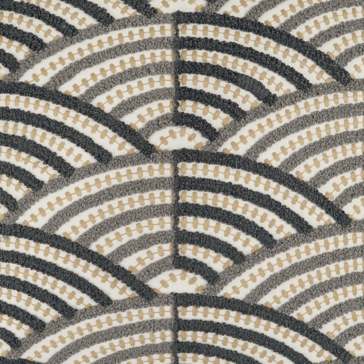 Close-up of textured woven fabric featuring beige, gray and black semicircular arches in a scallop pattern.