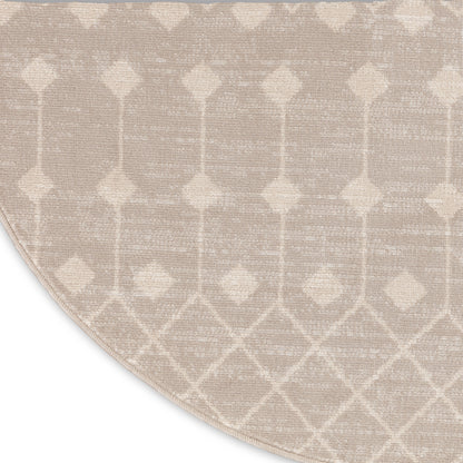 Beige round area rug with cream geometric lattice of diamonds; woven texture for modern neutral decor.