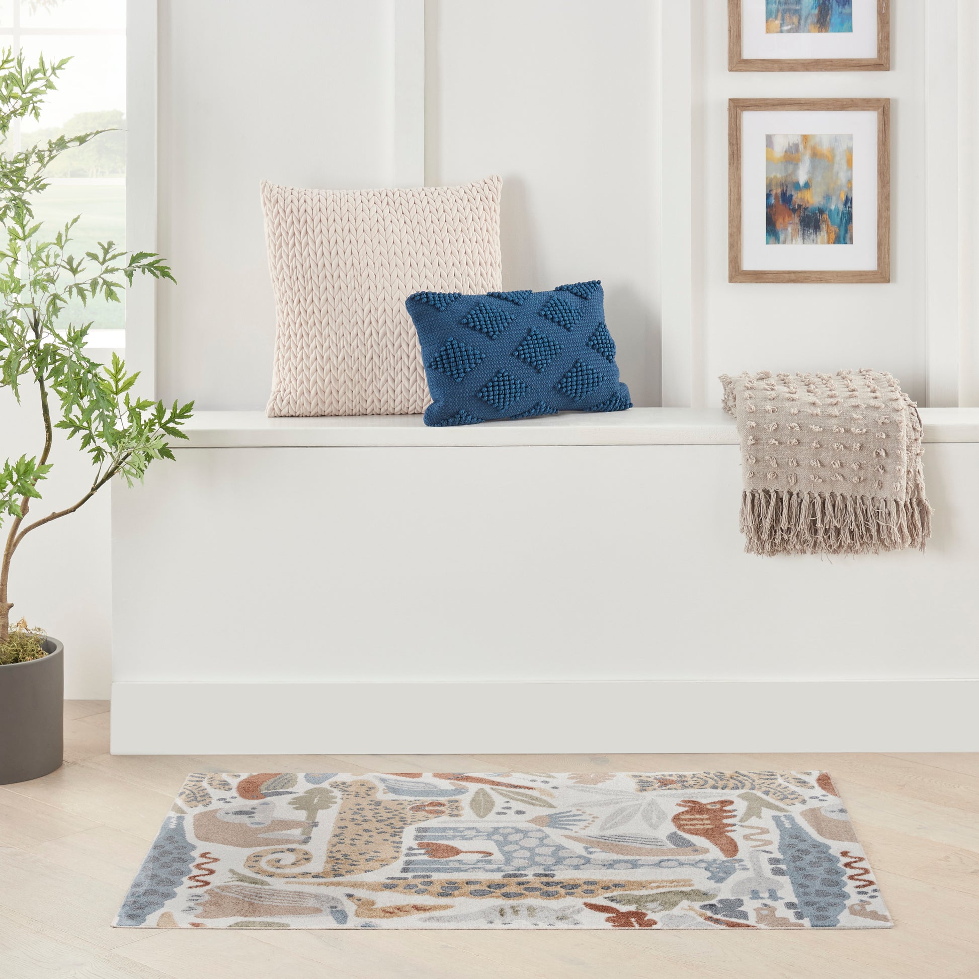 Kids 2' x 4' rug with an abstract beige and blue pattern.