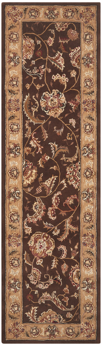 Brown oriental runner rug with a dark center and tan floral border of scrolling blossoms.