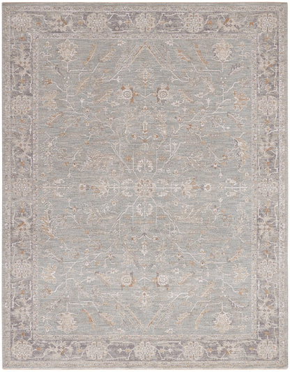 Soft-pile blue-gray area rug with ivory floral medallions and scrolling border; antique oriental style.