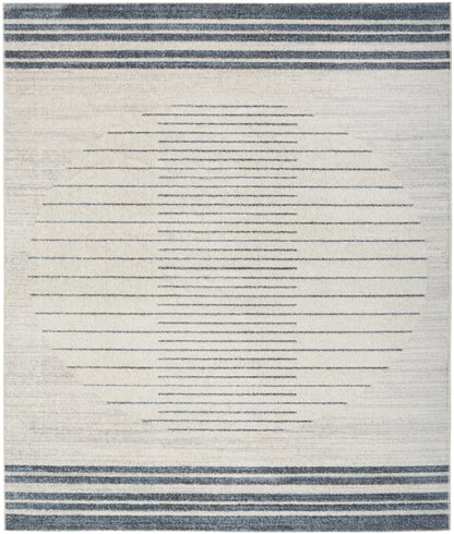 Beige woven area rug with a large circle formed by thin navy horizontal lines, and navy striped borders at top and bottom.