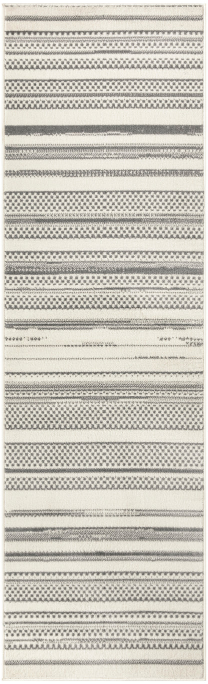 Neutral-toned flatwoven runner rug with alternating black and gray stripe motifs on cream background; modern geometric style.