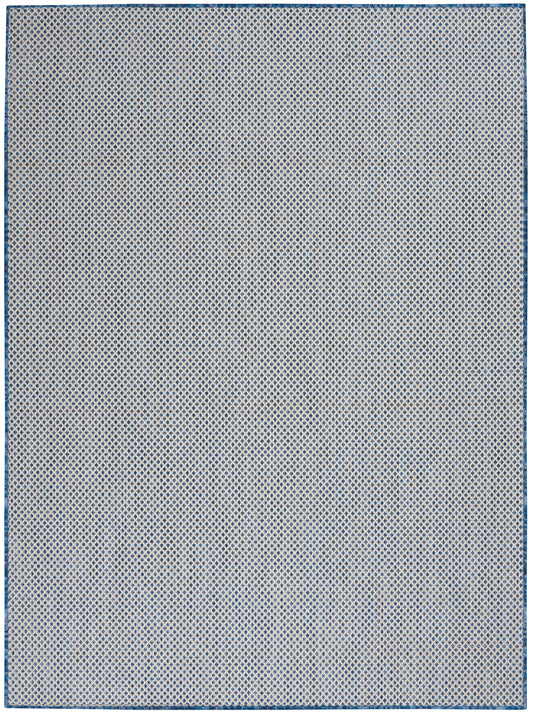 Rectangular blue and white rug with tiny diamond lattice pattern and blue border.
