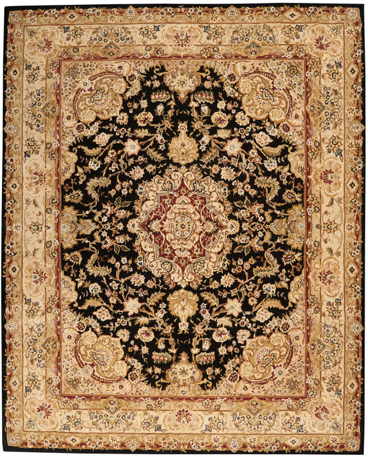 Persian-style rug with black field, ornate central medallion and gold floral motifs, beige-gold border, red inner border.