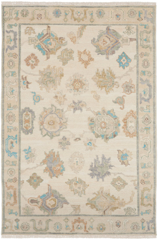 Soft beige oriental area rug with pastel blue, sage, taupe floral medallions and a bordered pattern; fringe edges.