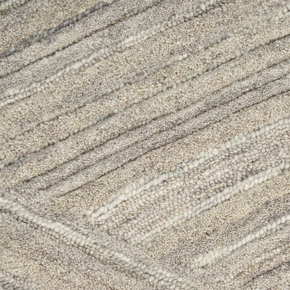 Beige-gray textured loop-pile rug with soft diagonal wave stripes, plush neutral-toned decor.
