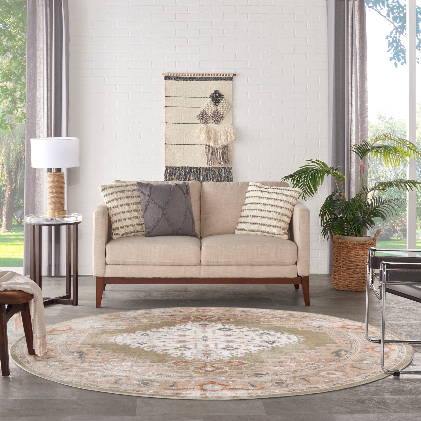 Beige round vintage rug on the floor with a subtle pattern.