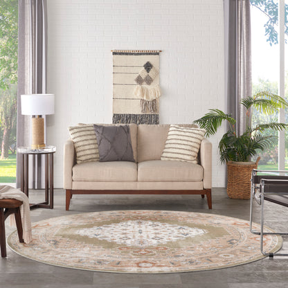 Beige round vintage rug on the floor with a subtle pattern.