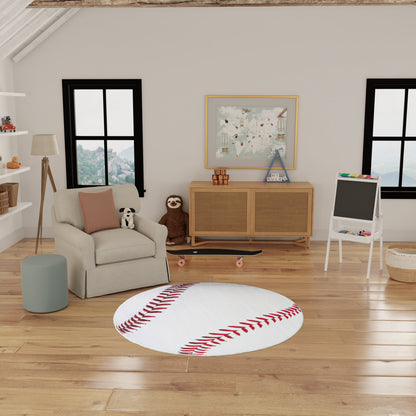 Round white baseball-stitch rug on wooden floor in cozy kids lounge with gray armchair, pastel cushions.
