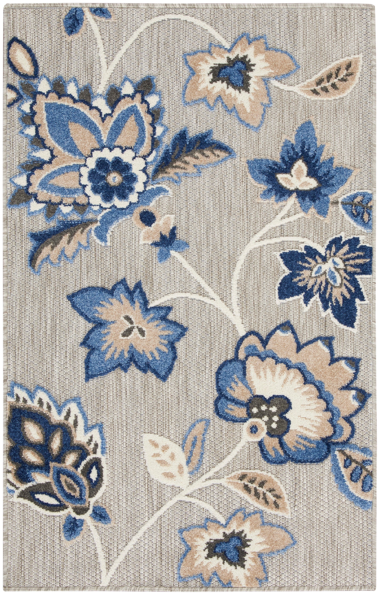 Rectangular woven rug featuring bold blue and tan floral pattern on a light beige background.