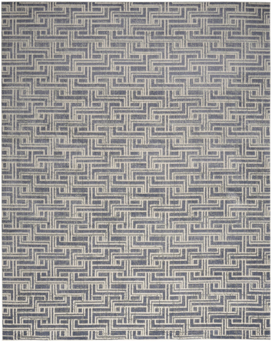 Navy and ivory Greek-key meander pattern on a textile with repeating interlocking square motif.