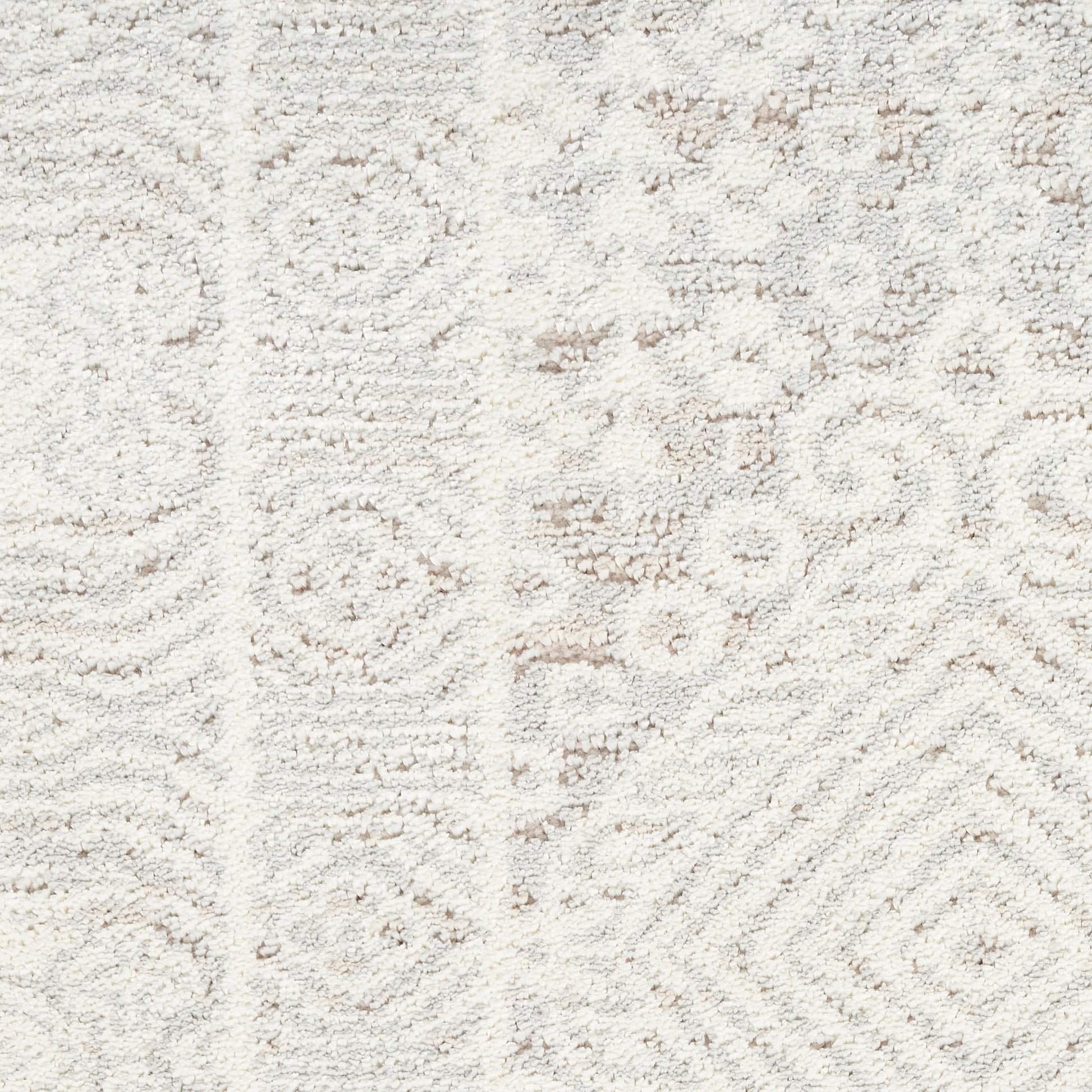 Cream-toned area rug with subtle ivory geometric motifs and plush textured pile.