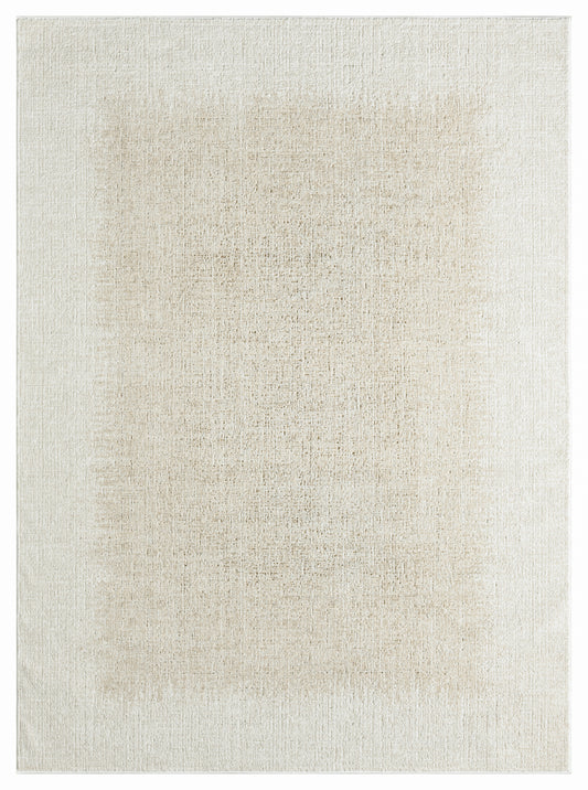 Rectangular beige area rug with a soft, distressed texture and cream-tan tones.