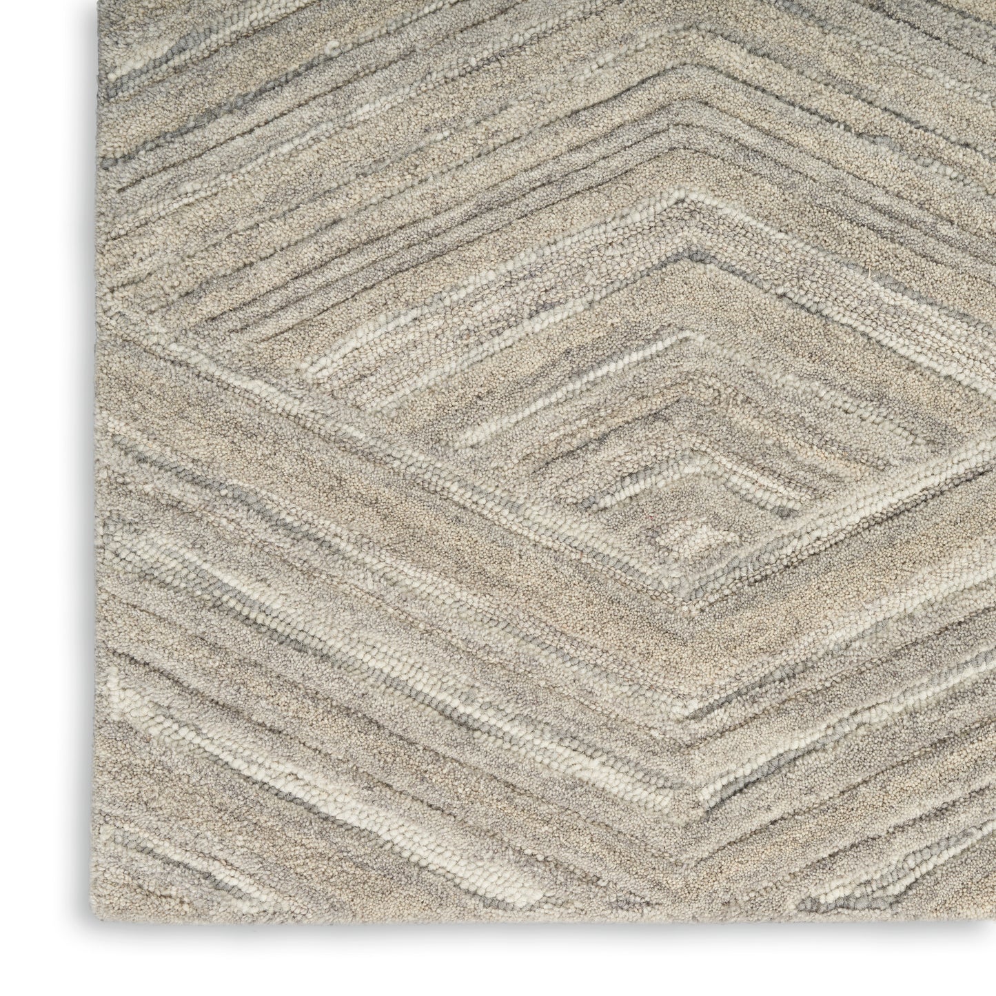 Beige textured rug with chevron diamond pattern and soft pile, modern neutral decor for living room or bedroom.