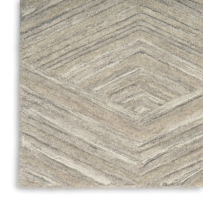 Beige textured rug with chevron diamond pattern and soft pile, modern neutral decor for living room or bedroom.